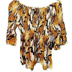 Ladies size 1x top from Unique Spectrum with Smocking. NWT